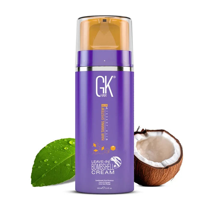 GK Hair Leave-In Bombshell Cream, purple 100 ml pump bottle with an orange pump, beside a green leaf and half a coconut