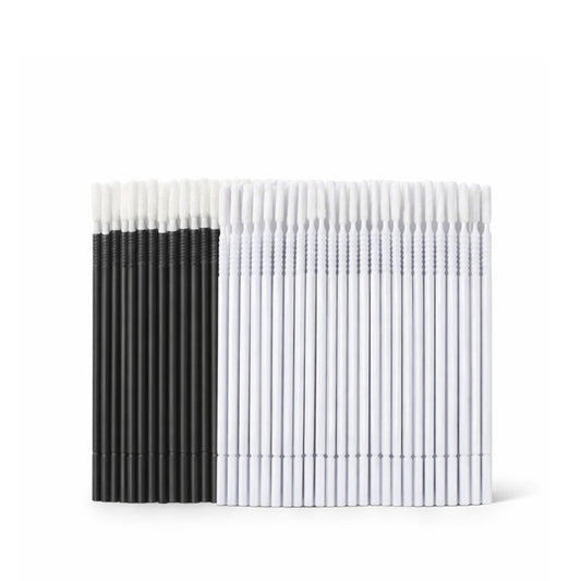 Black and white long tip micro brushes on a white background