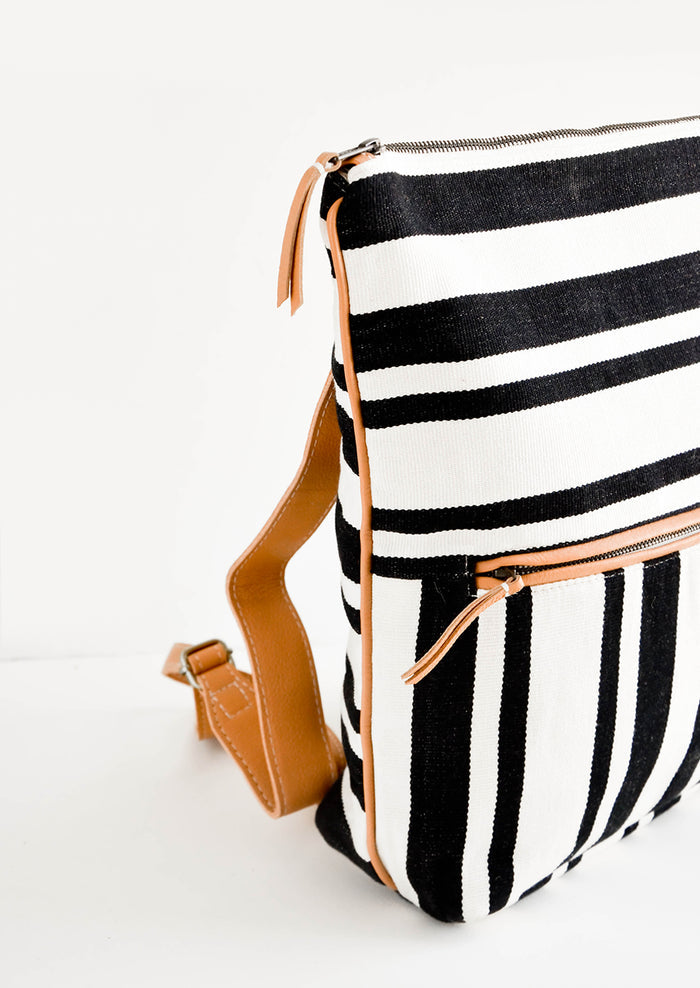 Fashion backpack in black and white striped cotton canvas with tan leather accents