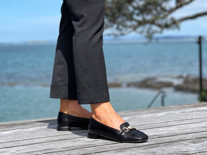 A pair of white loafers with gold embellishment detailing, comfortable, quality European women's shoes. Soft square toe available in black.