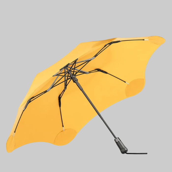 Yellow umbrella with black ribs on a white background