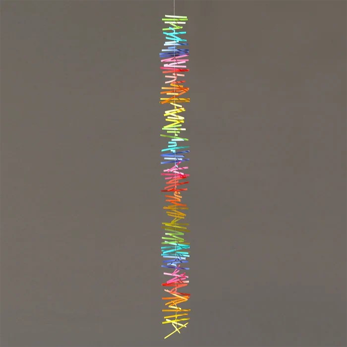 Colorful spectral paper streamers arranged in vertical rainbow gradients, abstract modern decorative design with vibrant multicolor strips.