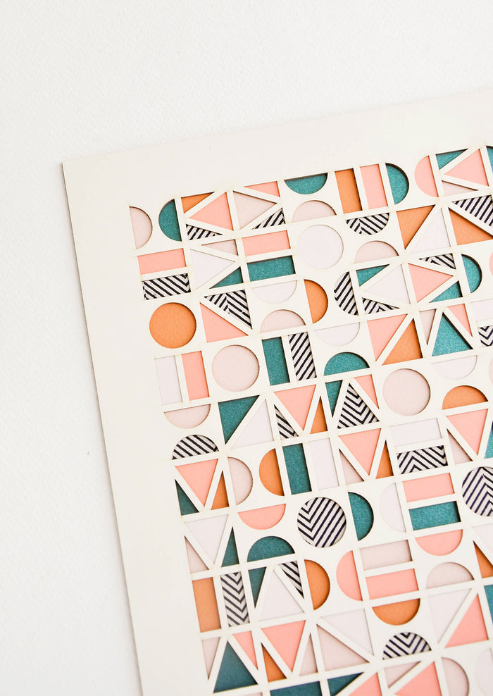 Artwork made of layered paper, composed of a mix of patterns, shapes and colors