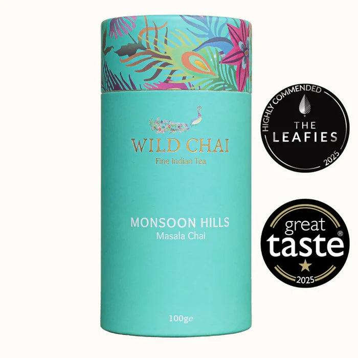 Tea canister labeled 'Wild Chai' with decorative lid and certification logos on a white background