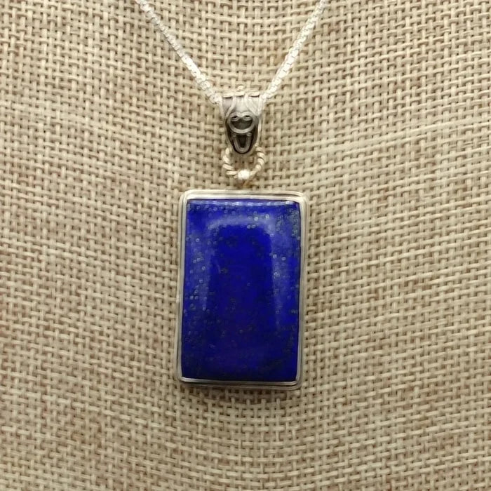 Close up of the rectangular Sterling Silver and blue Lapis Lazuli pendant.