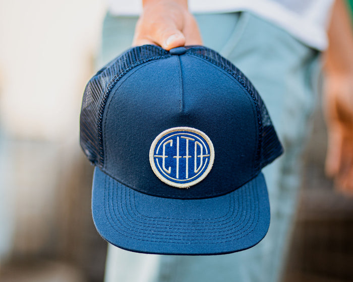 blue suavecito hat with white embroidered text and blue background "cito" in round shape