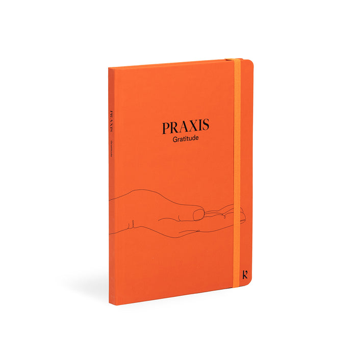 Karst Praxis Gratitude guided journal with orange hardcover and elastic band, mindfulness notebook designed for daily gratitude practice, reflection, and personal growth.