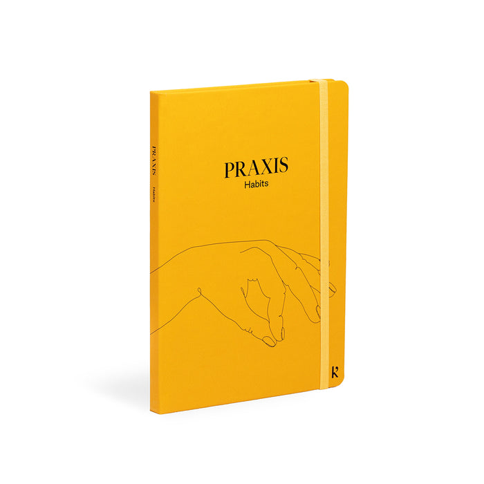 Karst Praxis Habits guided journal with yellow hardcover and elastic band, self-improvement notebook designed for habit tracking, goal setting, and building positive daily routines.