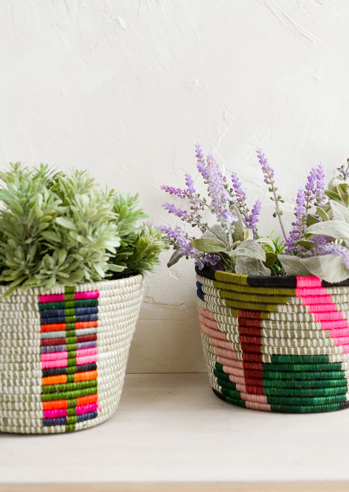 Colorful woven round planter baskets.