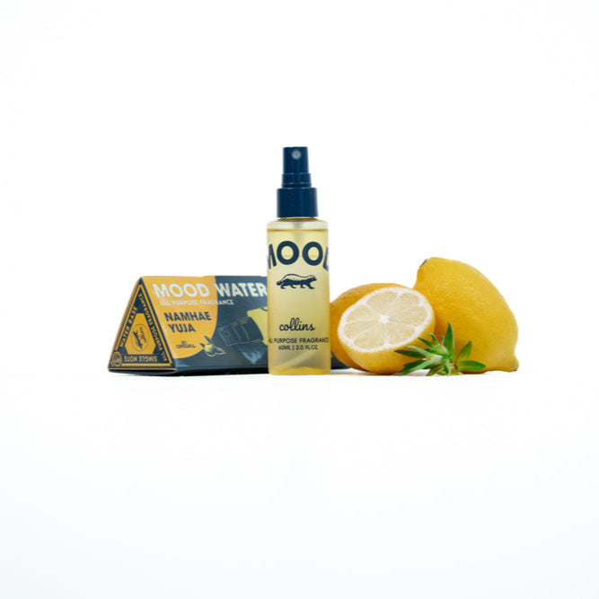 Mood water bottle and packaging with lemons on a white background