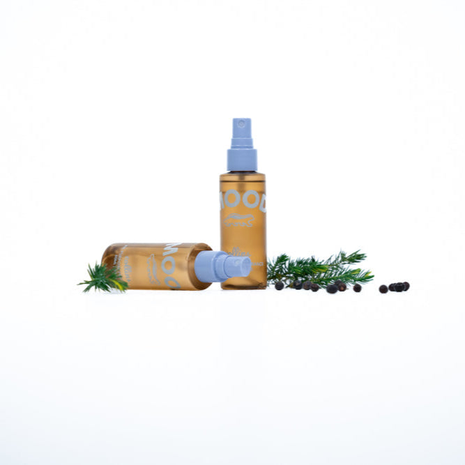 Two bottles of a product with a white background