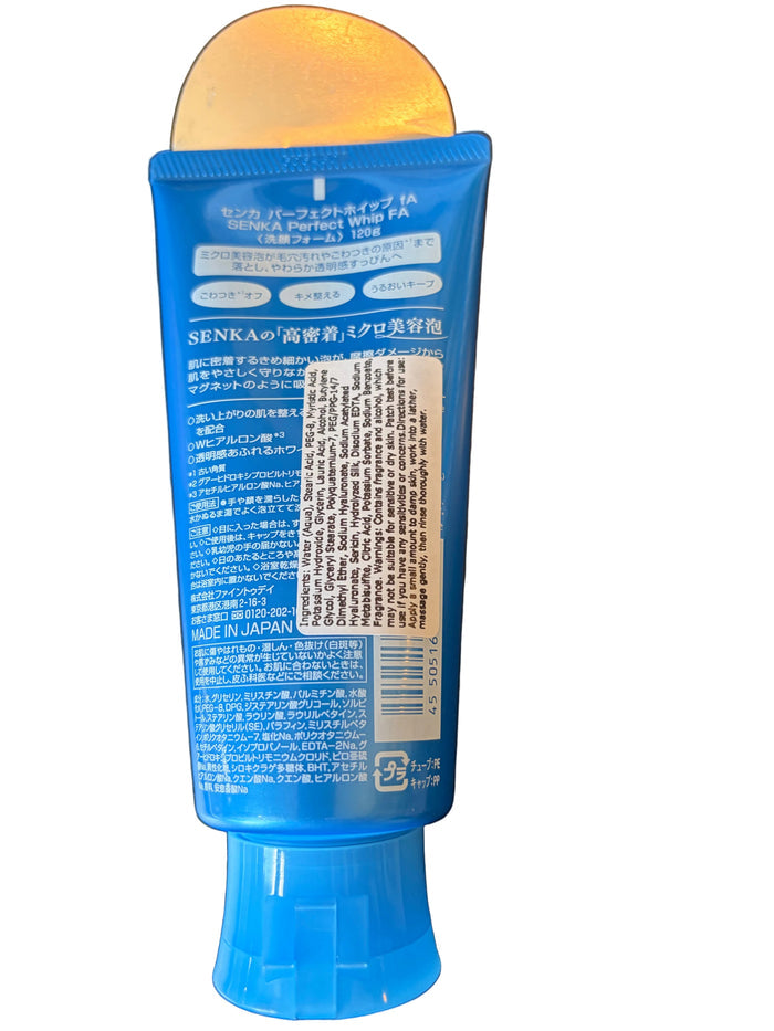 Blue bottle with label on a dark surface