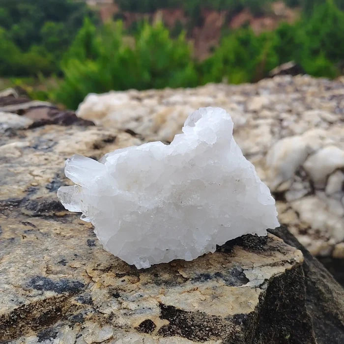 This is the glass back on the bottom of this small quartz cluster