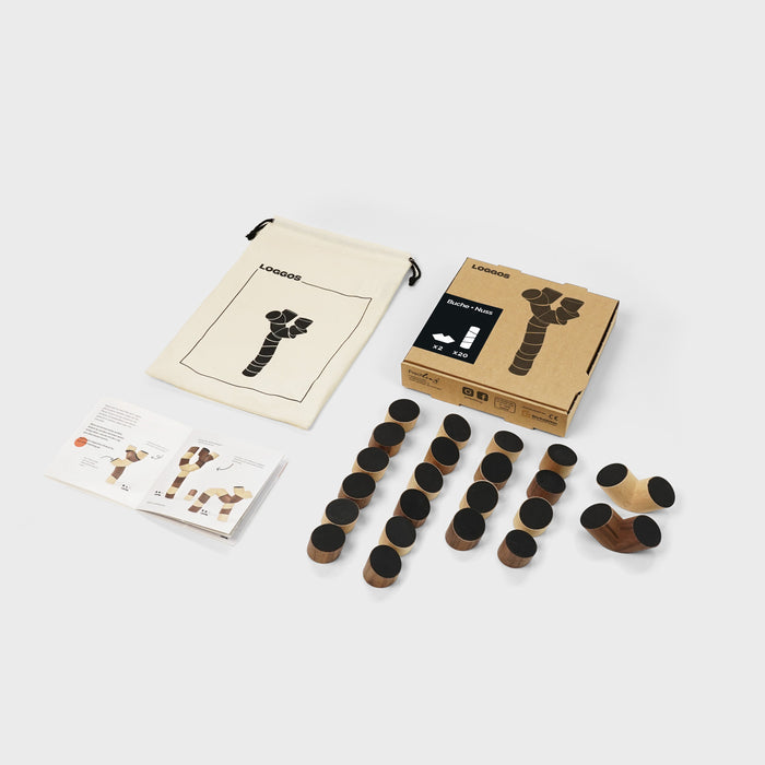 Collection of black cylindrical objects with packaging on a white background