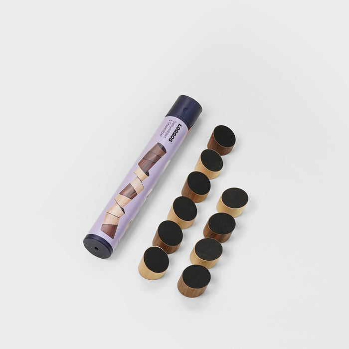 Makeup product with applicators on a light gray background
