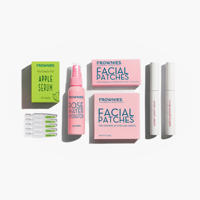 Frownies skincare products including facial patches, apple stem cell serum, lash and brow serums, and rose water hydrator spray on a white background