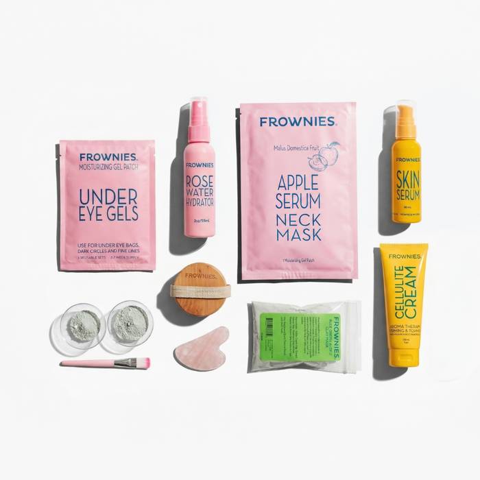 Frownies skincare products including under eye gels, serums, clay mask, rose water hydrator spray, and toning cream on a white background