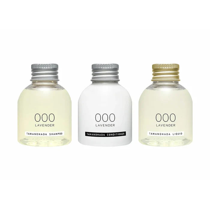 Three bottles of Tamanohada lavender shampoo, conditioner, and liquid on a white background