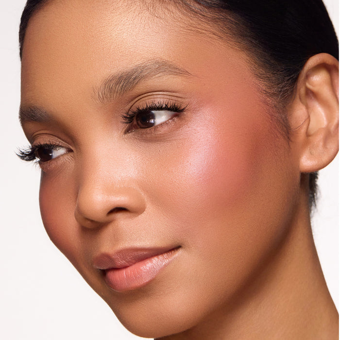 Close-up of a woman's face with color so sultry blush