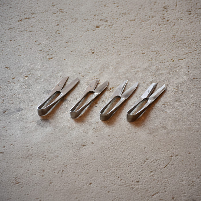 Set of metal tools on a textured surface