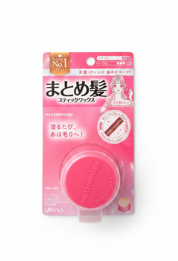 Pink hair product on a dark surface with visible text and branding.