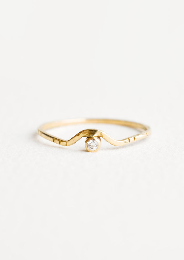 Yellow gold ring with etched decorative lines and a diamond set into an arched front.