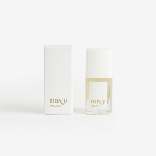 A nail treatment product from Navy Professional, featuring a small bottle of the vitamin-rich formula next to its packaging box, both with the brand name 'navy' printed on them.