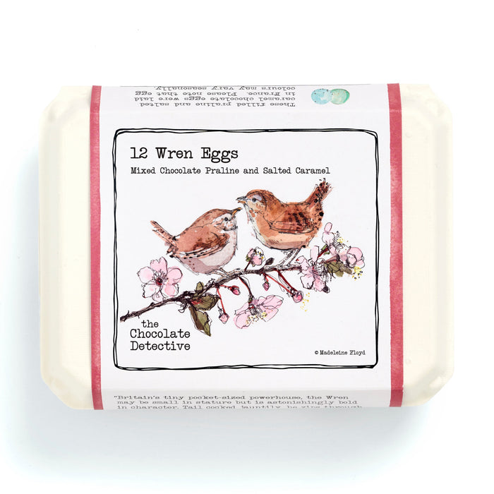 Bar of soap with a decorative label featuring birds and flowers on a white background